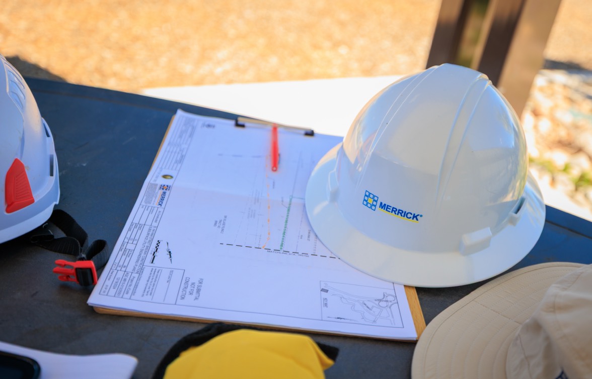 hard hat next to a blueprint