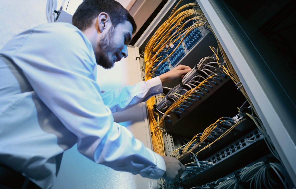 cybersecurity engineer working on server rack