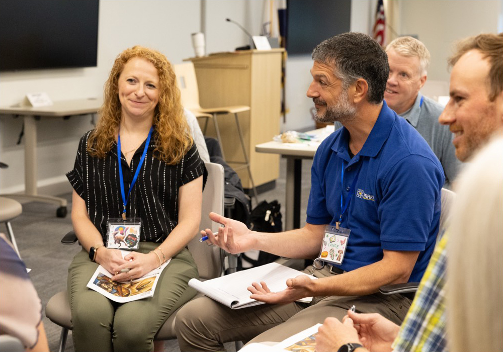 Merrick employees in chairs having a discussion