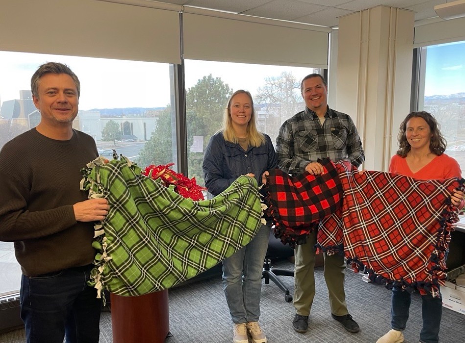 Merrick employees holding blankets