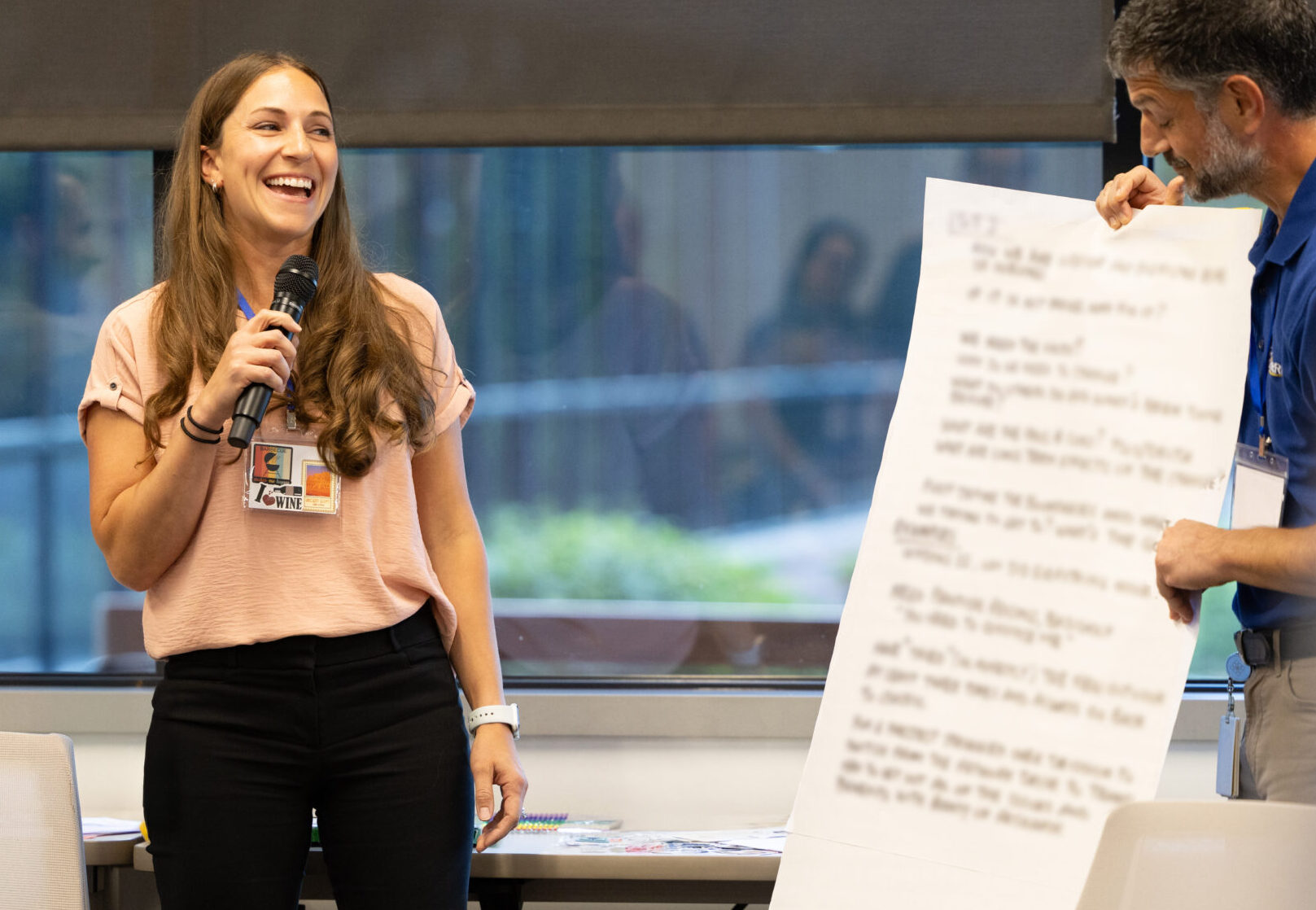 Merrick employee speaking at an office event